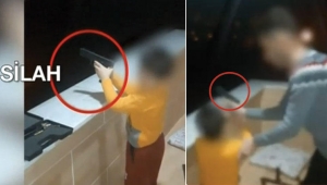 Bu kadar da olmaz! 4 yaşındaki çocuğuna silah verip...