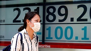 Japonya büyüme tahminini düşürüyor